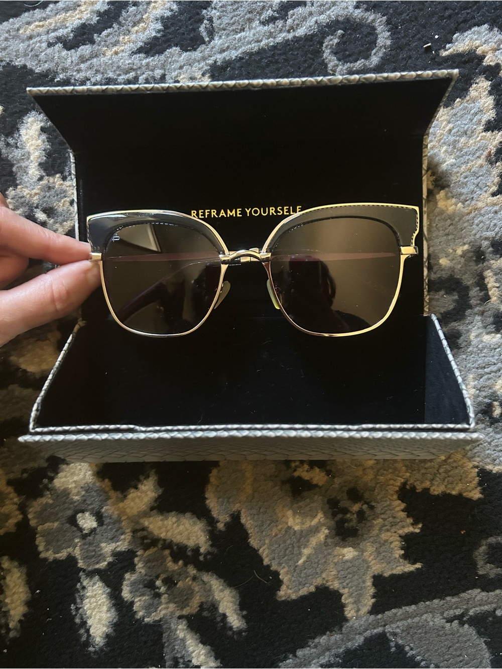 Gold Metal Frame Sunglasses, hatched dark lenses.